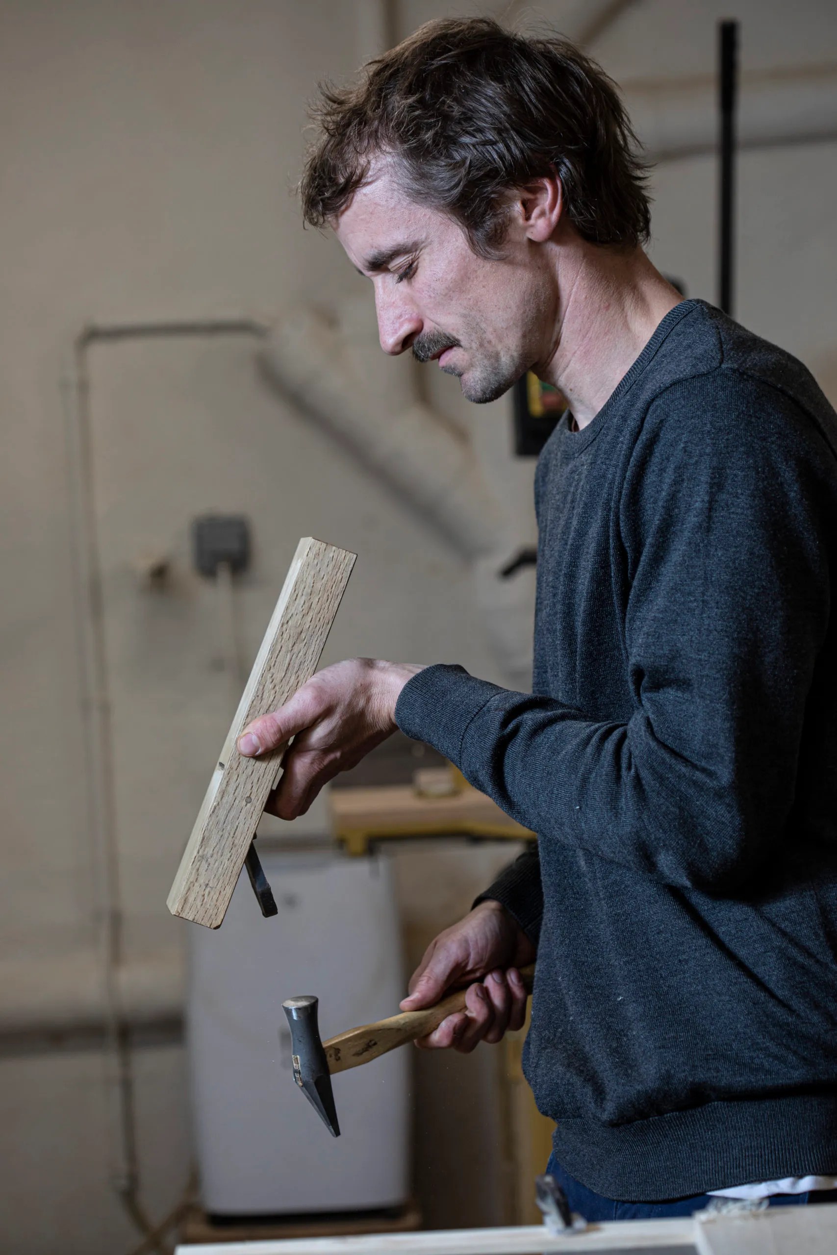 A woodworker at work in their workshop